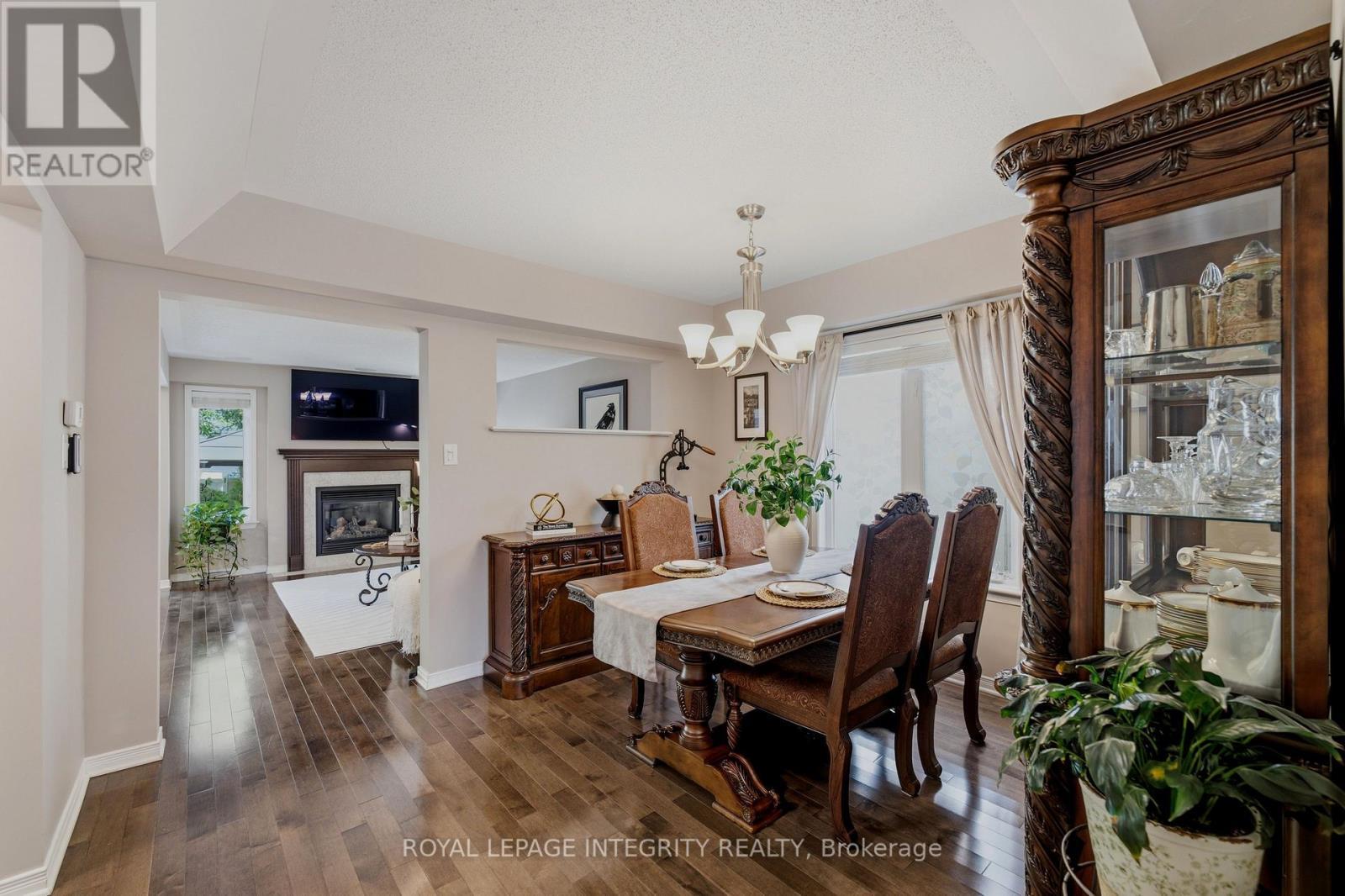 355 Celtic Ridge Crescent, Ottawa, ON - Indoor Photo Showing Dining Room With Fireplace