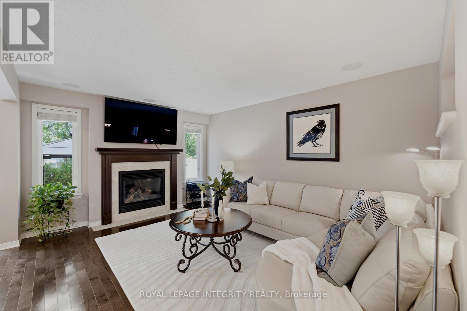 355 Celtic Ridge Crescent, Ottawa, ON - Indoor Photo Showing Living Room With Fireplace