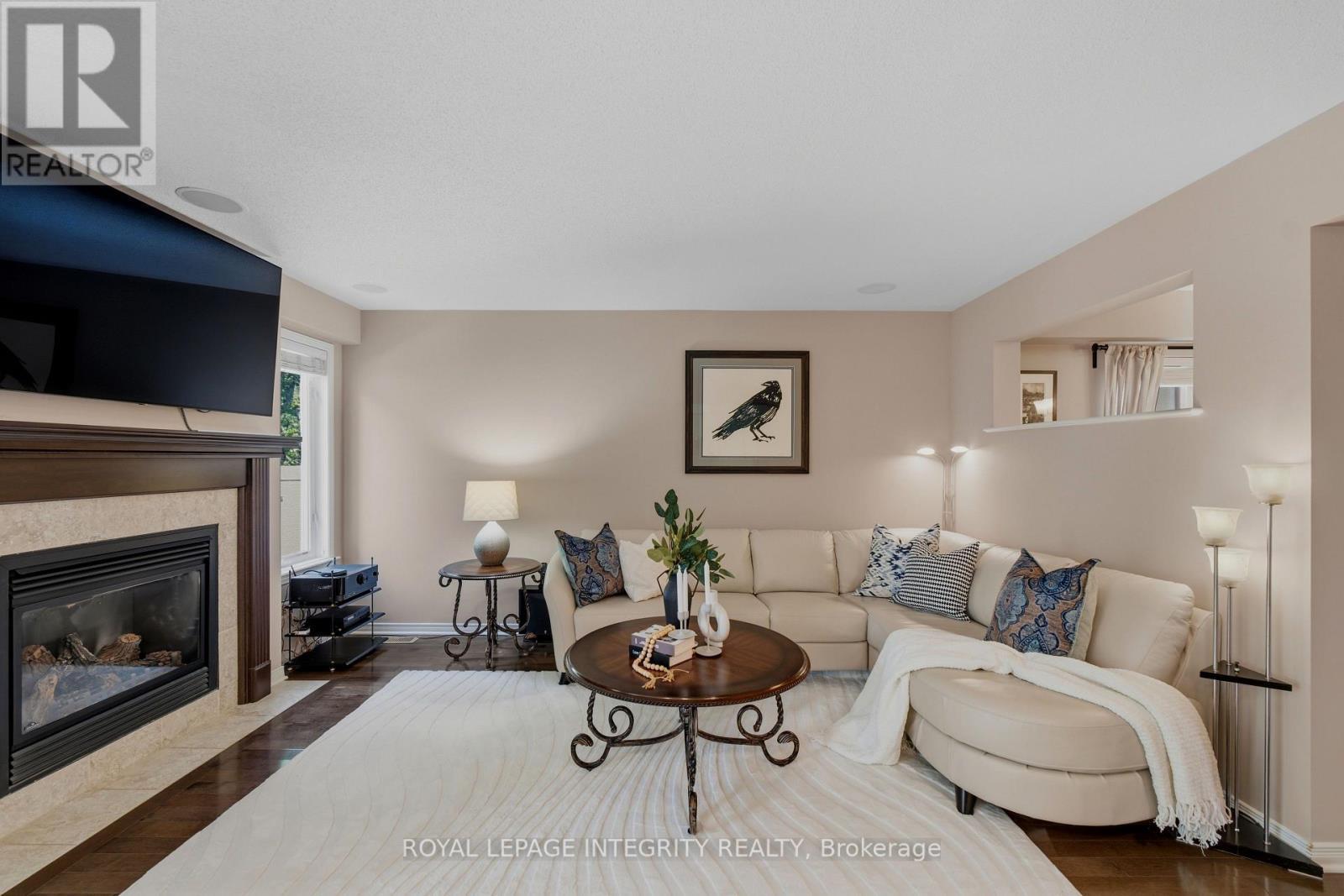 355 Celtic Ridge Crescent, Ottawa, ON - Indoor Photo Showing Living Room With Fireplace