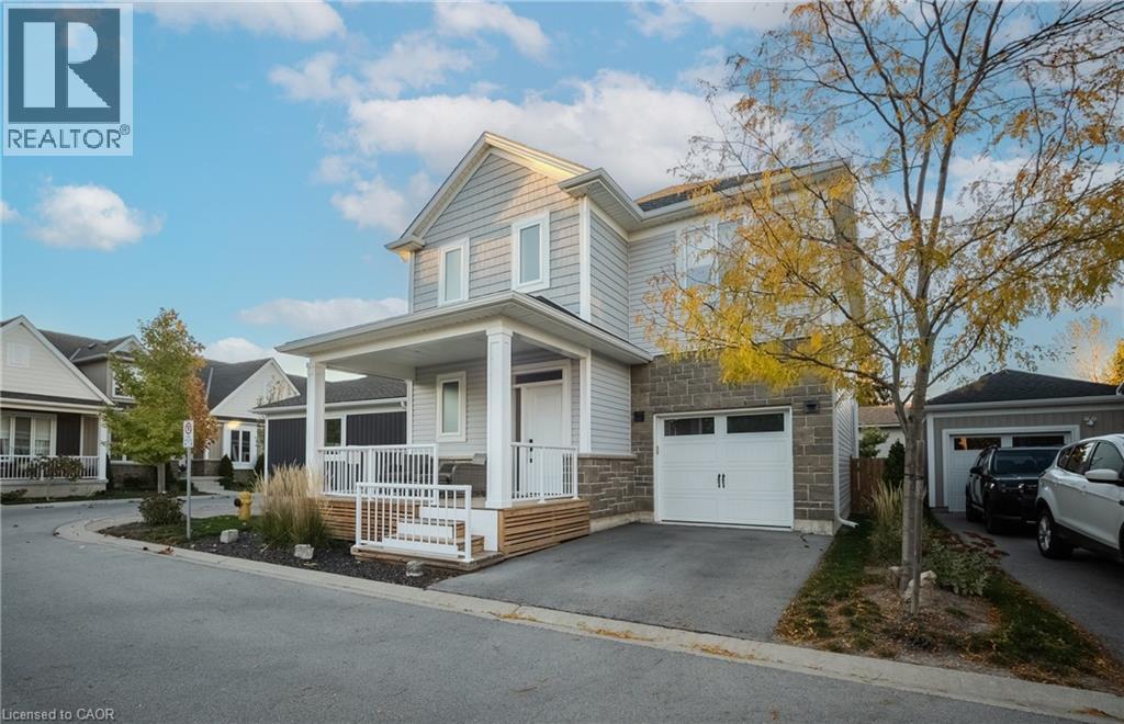 Two-story residence featuring light gray siding and stone veneer accents - 9 Princeton Common, St. Catharines, ON - Outdoor With Facade