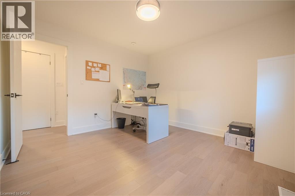 Light wood-finish flooring with a herringbone pattern throughout - 9 Princeton Common, St. Catharines, ON - Indoor Photo Showing Office