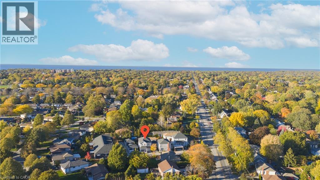 Aerial perspective showcasing residential properties amidst extensive tree coverage - 9 Princeton Common, St. Catharines, ON - Outdoor With View