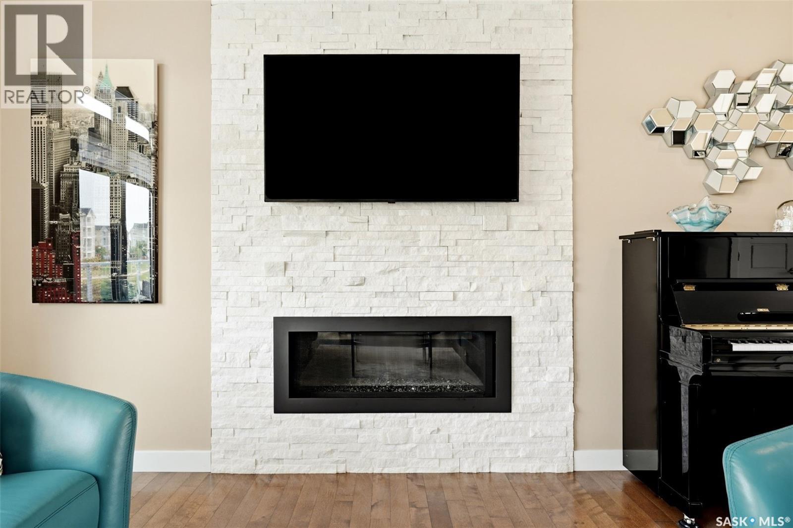 4665 Skinner Crescent, Regina, SK - Indoor Photo Showing Living Room With Fireplace