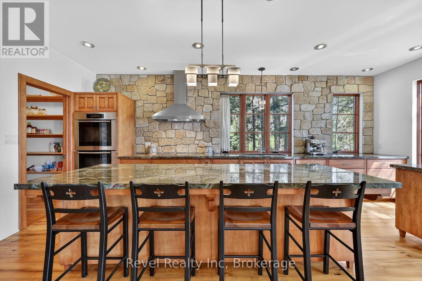 Rainforest marble countertops throughout - 12 Walker Road, Tiny, ON - Indoor Photo Showing Dining Room