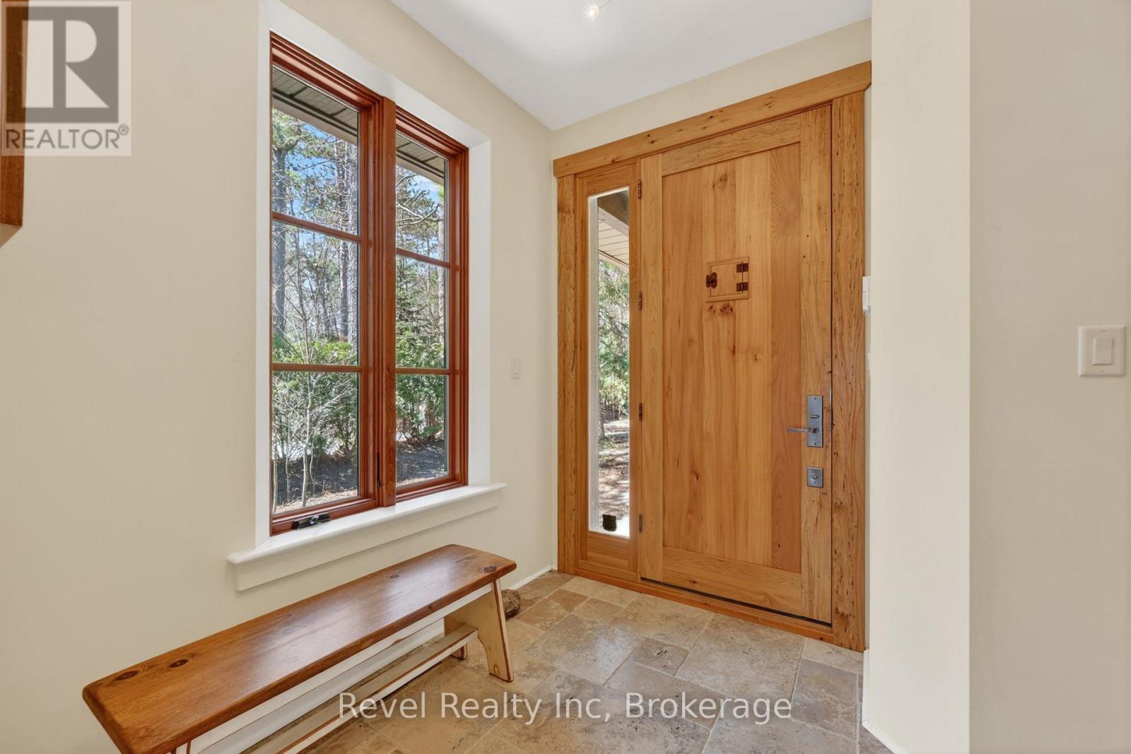 traventine marbe tiles, and Bouvet door hardware - 12 Walker Road, Tiny, ON - Indoor Photo Showing Other Room