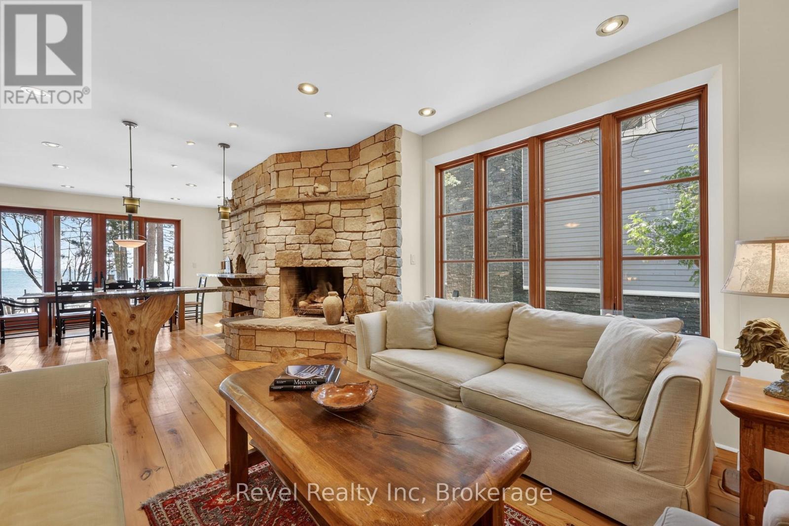 reclaimed elm floors and potlights ( led & halogen - 12 Walker Road, Tiny, ON - Indoor Photo Showing Living Room With Fireplace