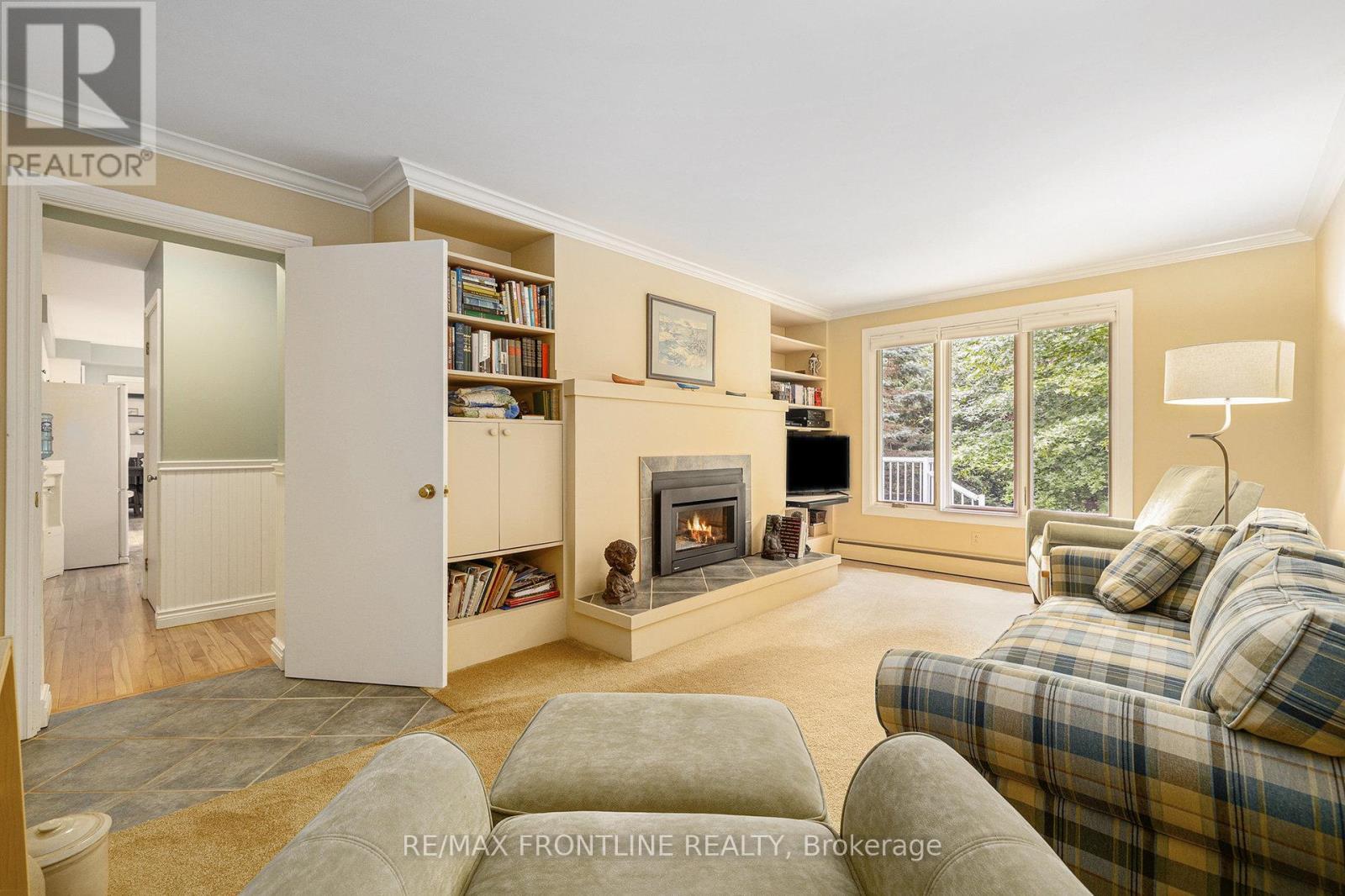 12 Glenview Crescent, Perth, ON - Indoor Photo Showing Living Room With Fireplace