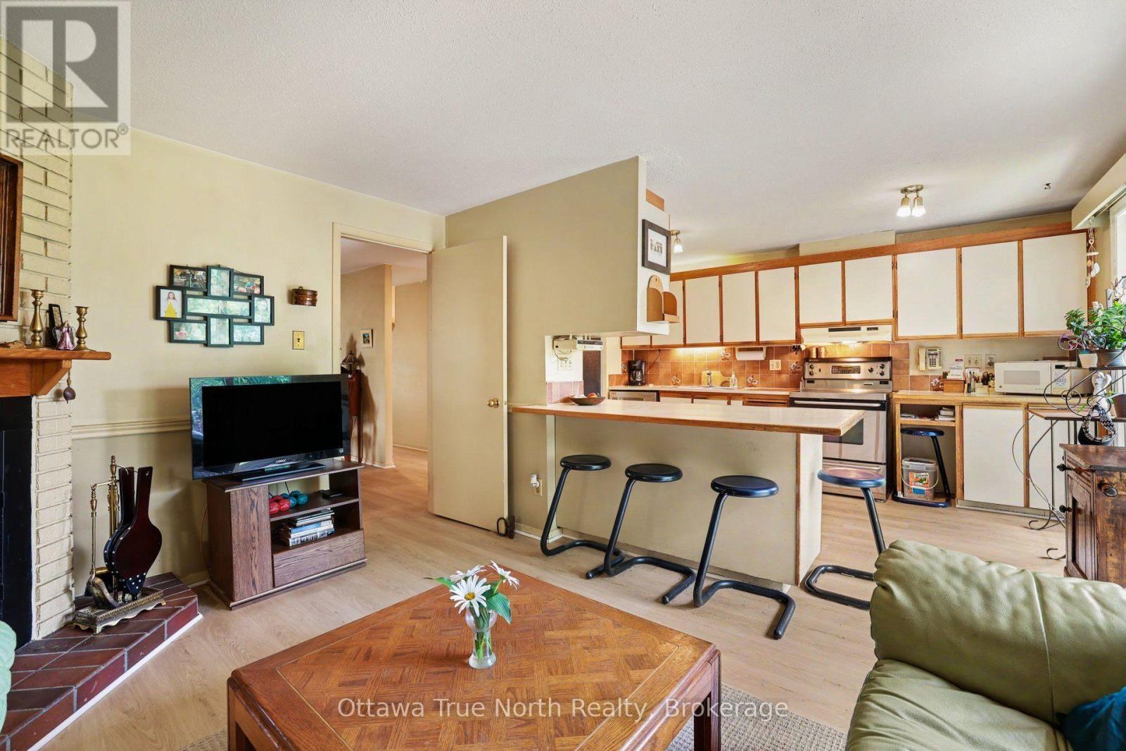 41 Aldgate Crescent, Ottawa, ON - Indoor Photo Showing Living Room With Fireplace