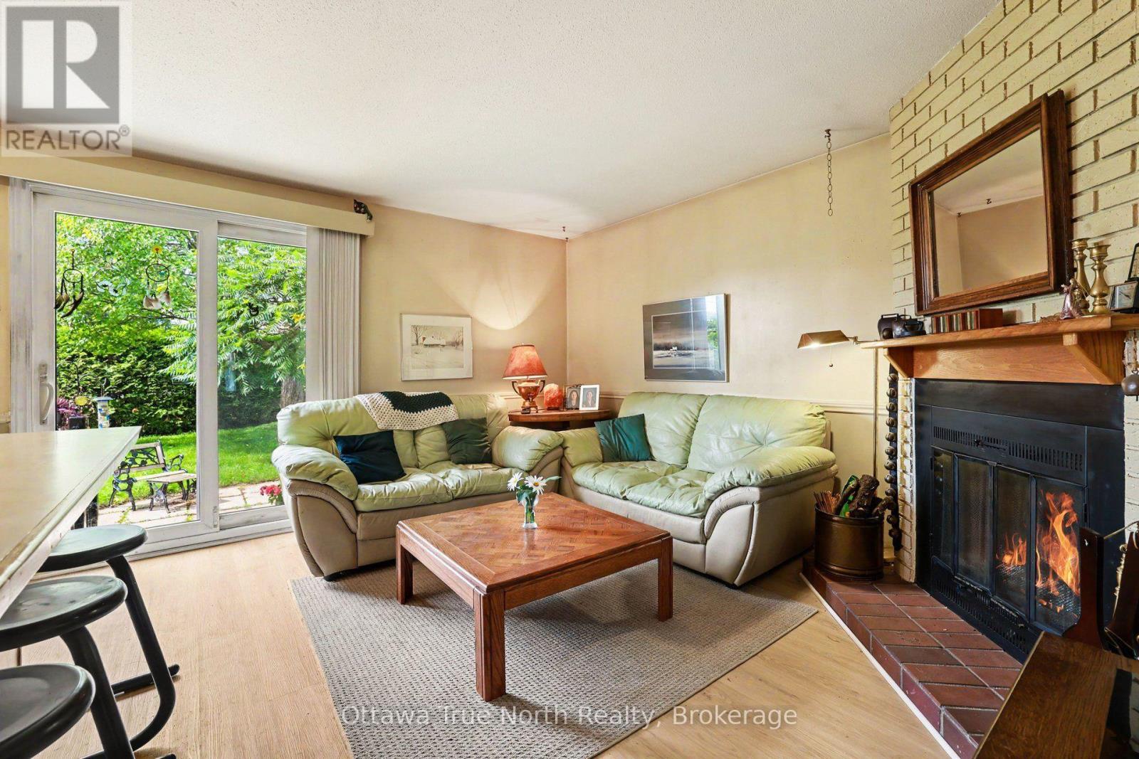 41 Aldgate Crescent, Ottawa, ON - Indoor Photo Showing Living Room With Fireplace