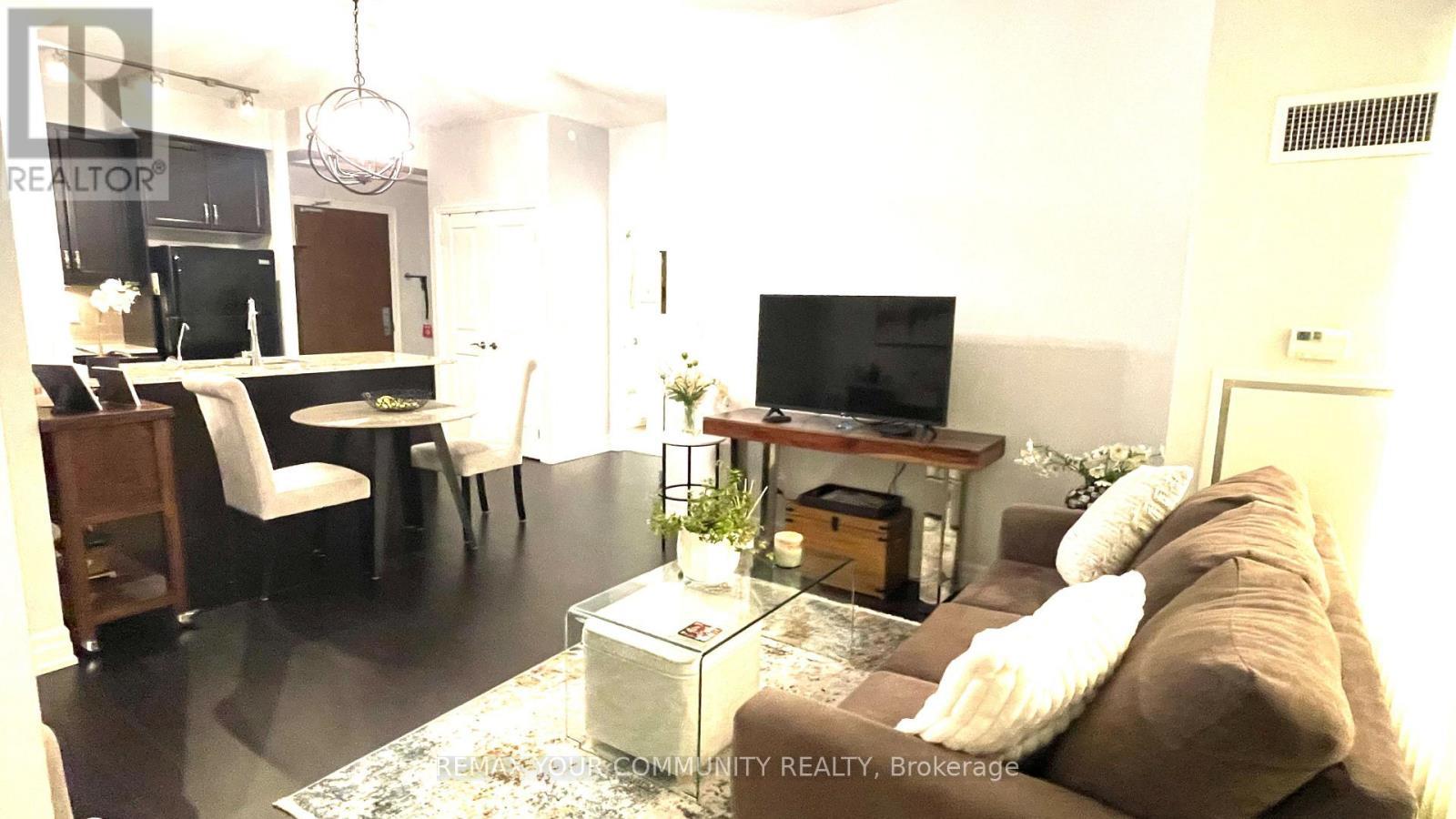 222 - 111 Civic Square Gate, Aurora, ON - Indoor Photo Showing Living Room With Fireplace