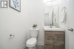 Upgraded powder room with designer vanity - 