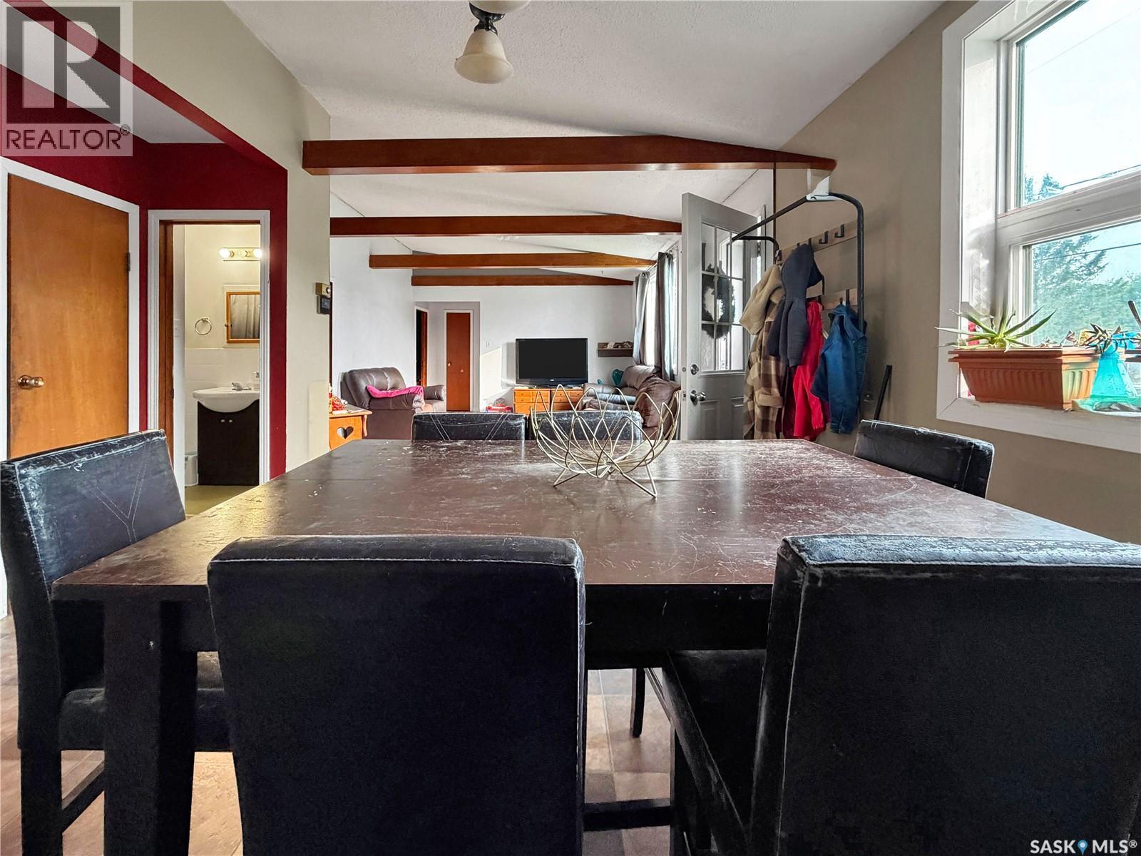 701 3Rd Avenue, Spy Hill, SK - Indoor Photo Showing Dining Room With Fireplace