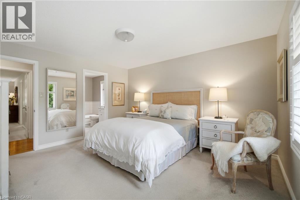 Carpeted bedroom with neutral wall tones and a textured headboard - 1090 Crofton Way, Burlington, ON - Indoor Photo Showing Bedroom