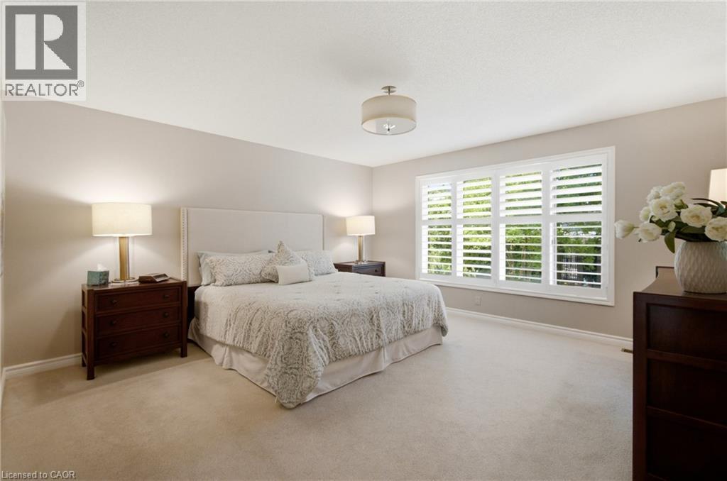 Expansive room with neutral wall tones and light-colored carpeting - 1090 Crofton Way, Burlington, ON - Indoor Photo Showing Bedroom