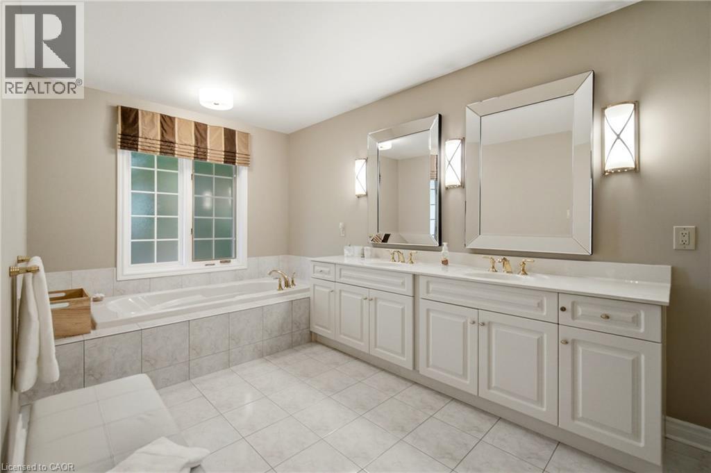 Bathroom featuring a double vanity with white cabinetry and countertops - 1090 Crofton Way, Burlington, ON - Indoor Photo Showing Bathroom