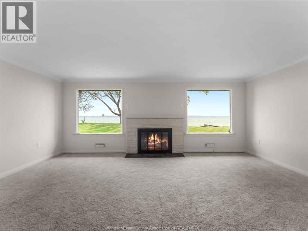 11506 Riverside, Windsor, ON - Indoor Photo Showing Living Room With Fireplace