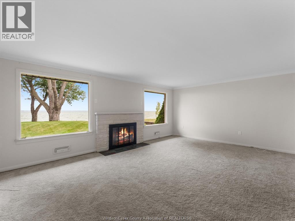 11506 Riverside, Windsor, ON - Indoor Photo Showing Living Room With Fireplace
