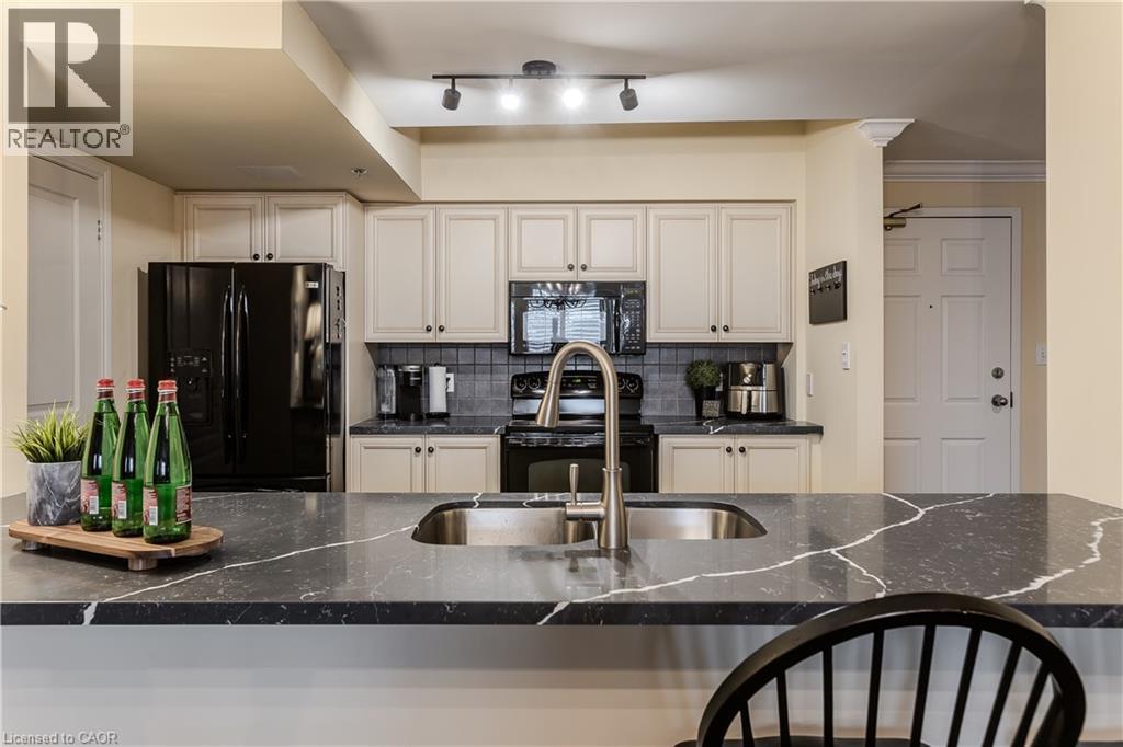 391 Plains Road E Unit# 412, Burlington, ON - Indoor Photo Showing Kitchen With Double Sink