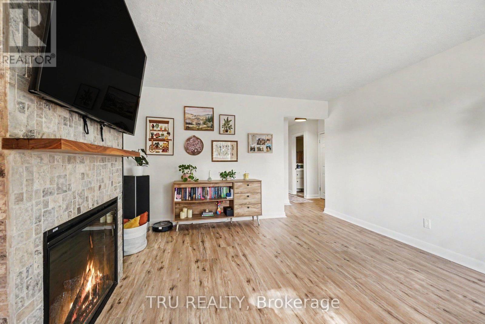 Living Room - 1275 Woodside Drive, Ottawa, ON - Indoor Photo Showing Living Room With Fireplace