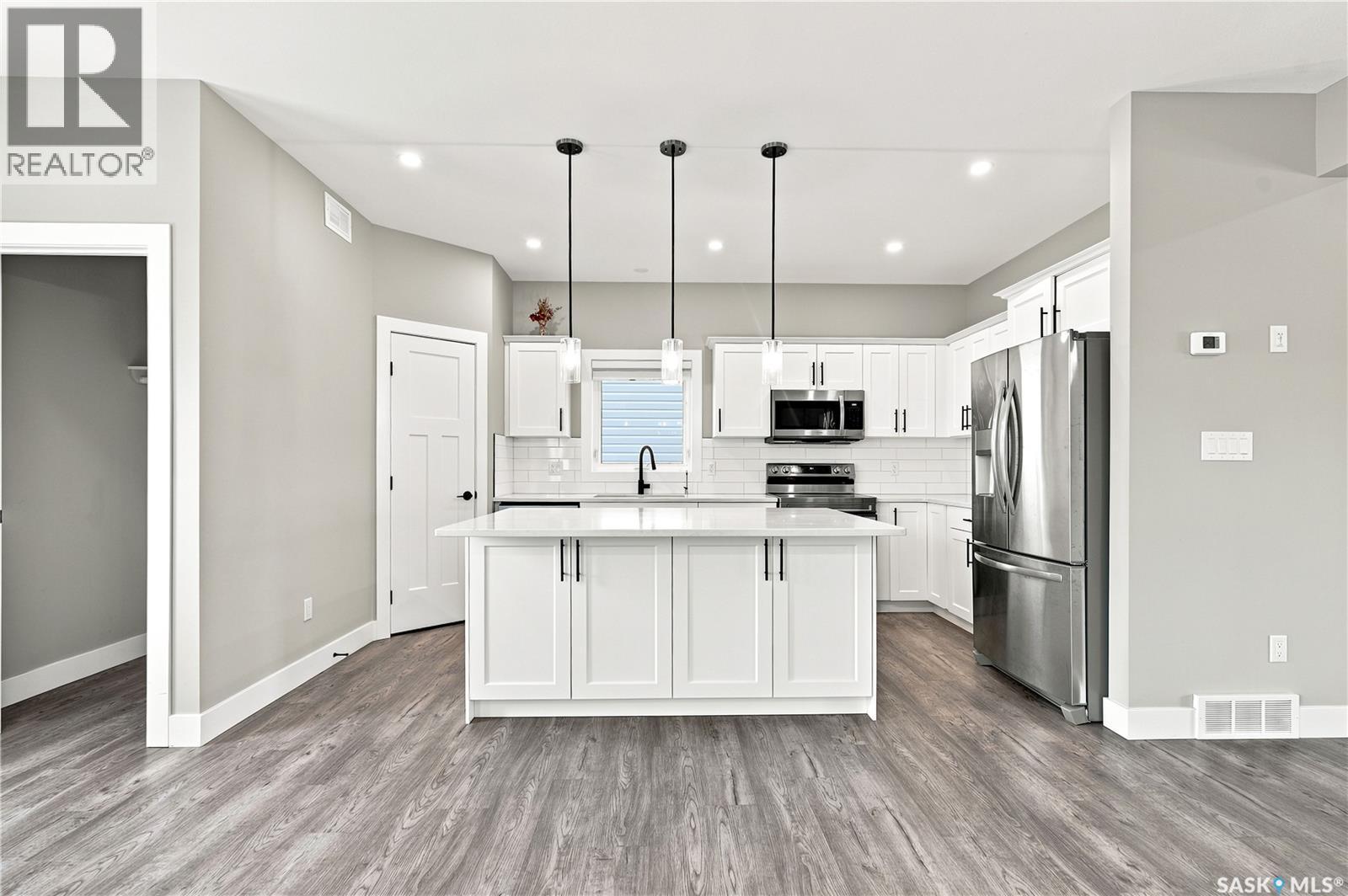 247 Thakur Street, Saskatoon, SK - Indoor Photo Showing Kitchen With Stainless Steel Kitchen With Upgraded Kitchen