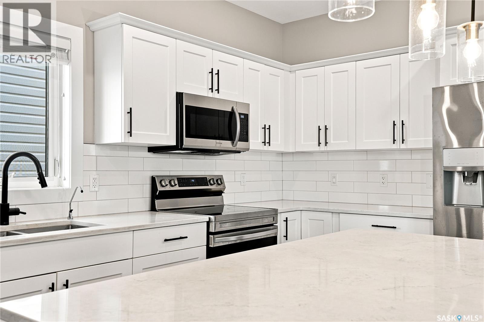 247 Thakur Street, Saskatoon, SK - Indoor Photo Showing Kitchen With Double Sink