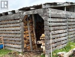 Woodshed with doorway to house -