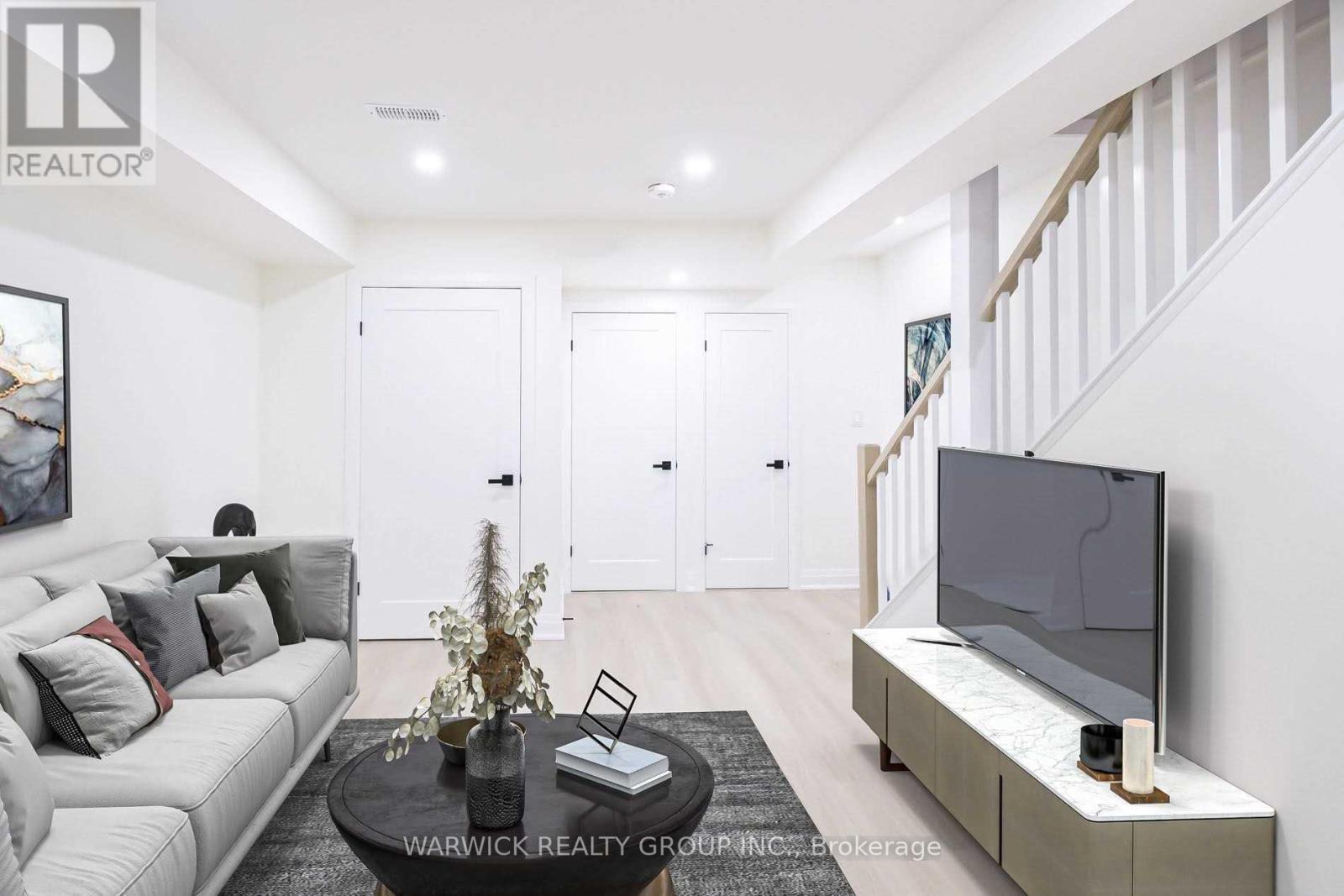 Lower - 57 Bertmount Avenue, Toronto, ON - Indoor Photo Showing Living Room