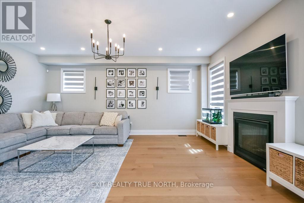 108 Rugman Crescent, Springwater, ON - Indoor Photo Showing Living Room With Fireplace