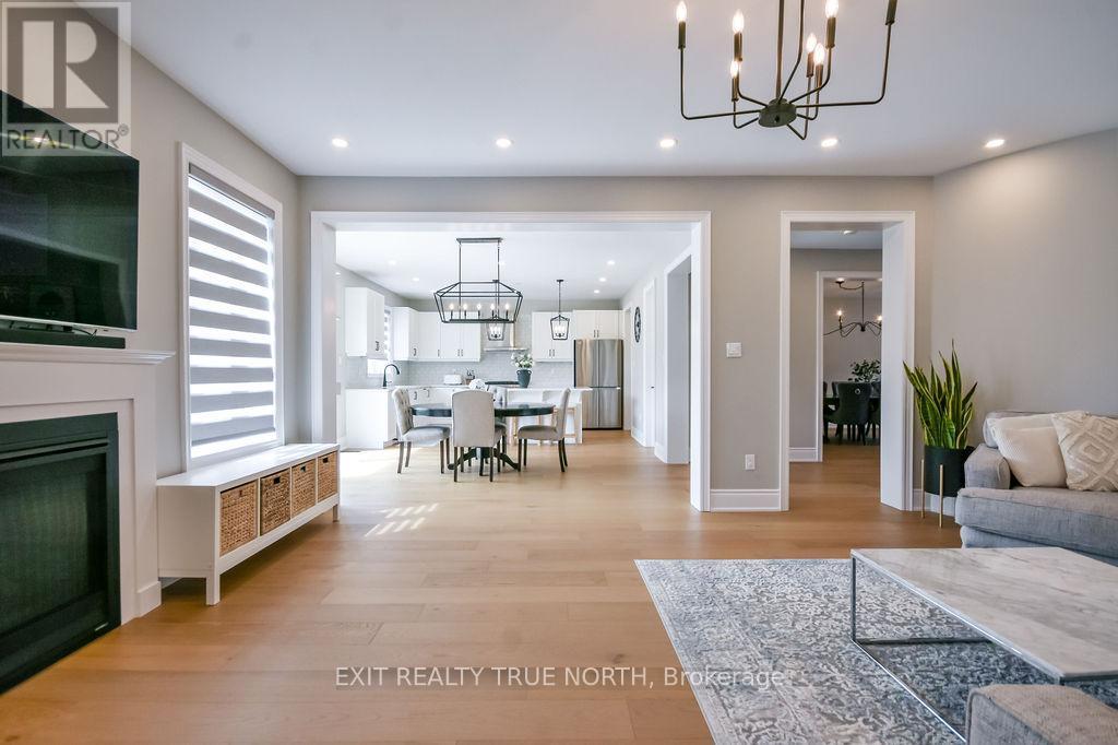 108 Rugman Crescent, Springwater, ON - Indoor Photo Showing Living Room With Fireplace