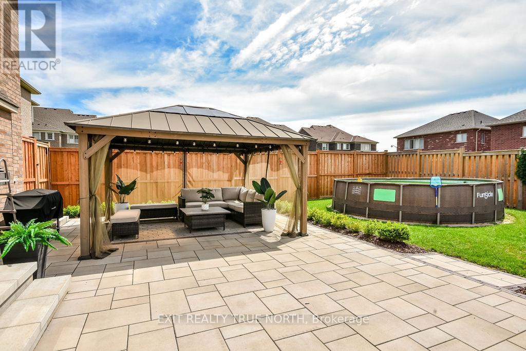 108 Rugman Crescent, Springwater, ON - Outdoor With Above Ground Pool