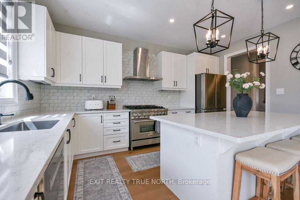 108 Rugman Crescent, Springwater, ON - Indoor Photo Showing Kitchen With Upgraded Kitchen