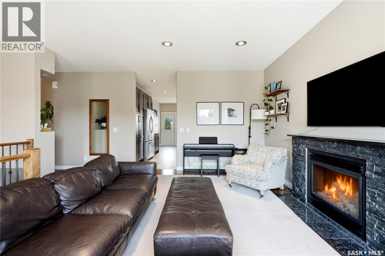 315 Werschner Lane, Saskatoon, SK - Indoor Photo Showing Living Room With Fireplace