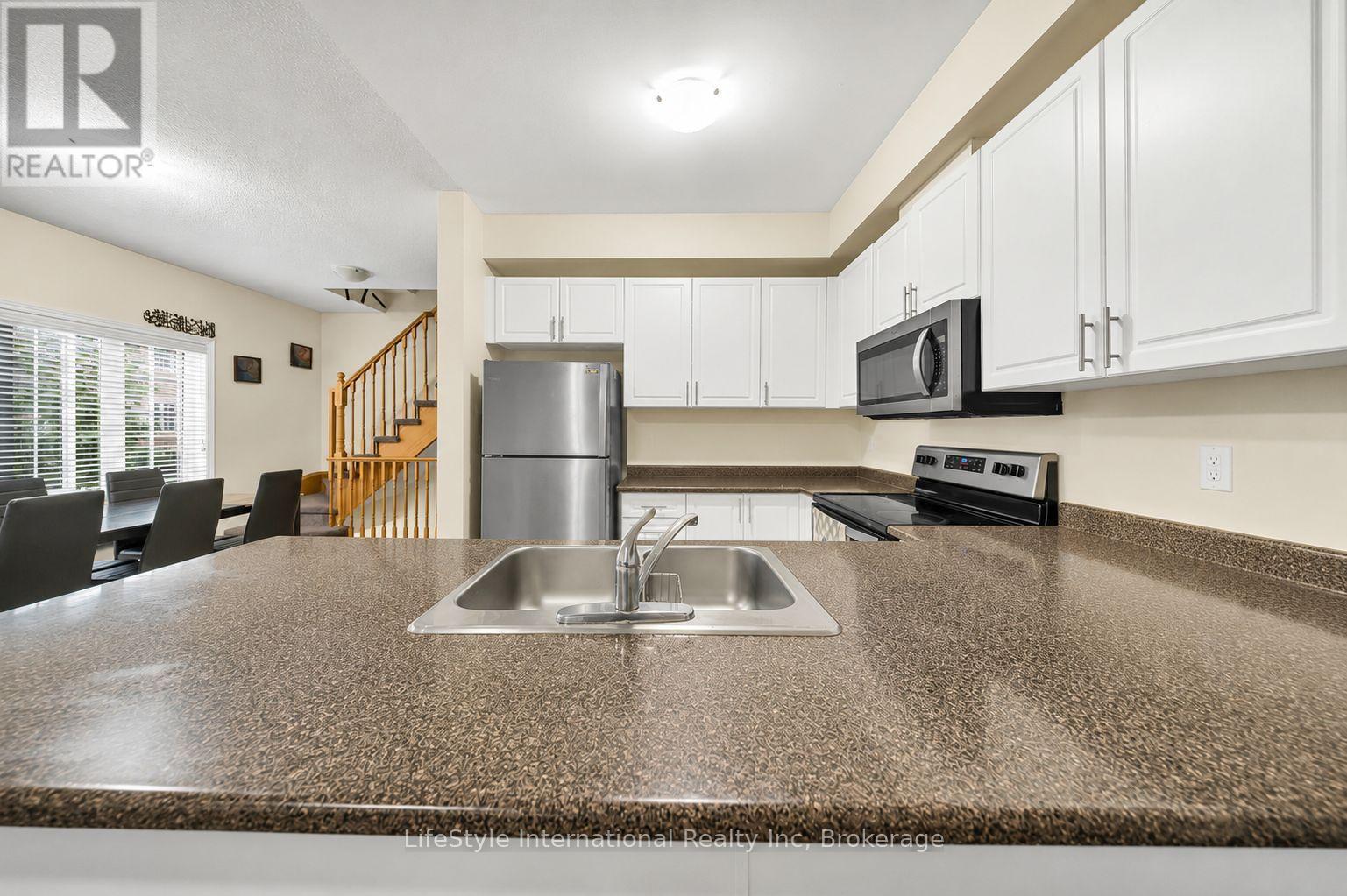 87 - 88 Decorso Drive, Guelph (Kortright East), ON - Indoor Photo Showing Kitchen With Double Sink