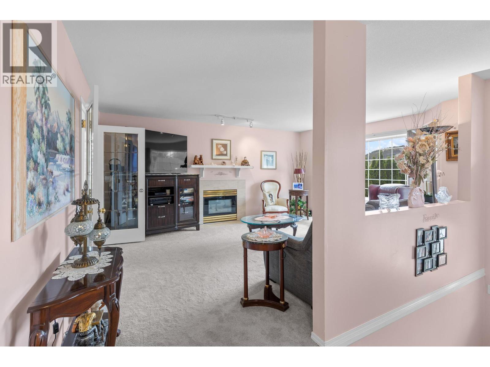 280 Cosens Court, Kelowna, BC - Indoor Photo Showing Other Room With Fireplace