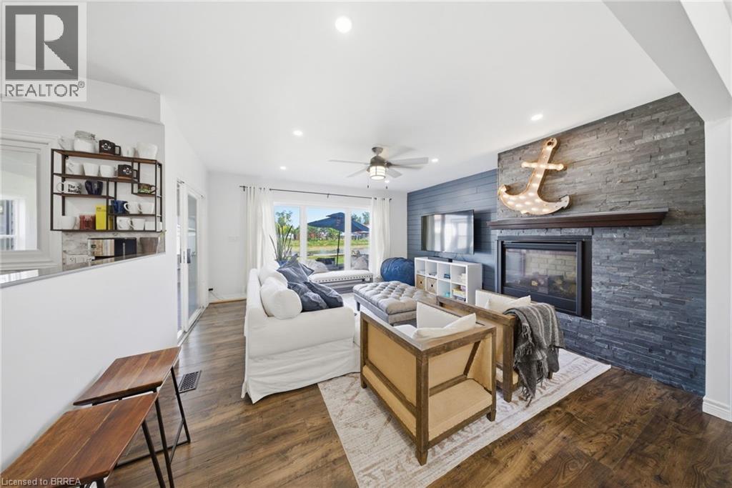 382 Cedar Drive, Turkey Point, ON - Indoor Photo Showing Living Room With Fireplace