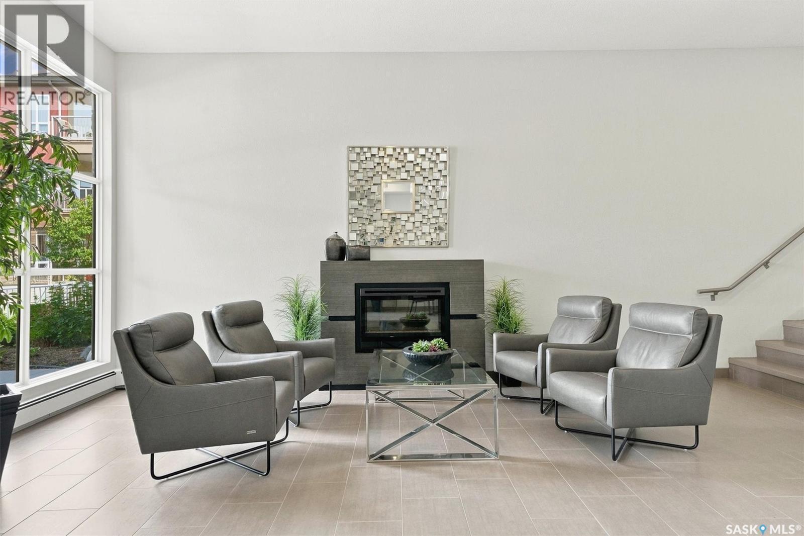 116 1025 Moss Avenue, Saskatoon, SK - Indoor Photo Showing Living Room With Fireplace
