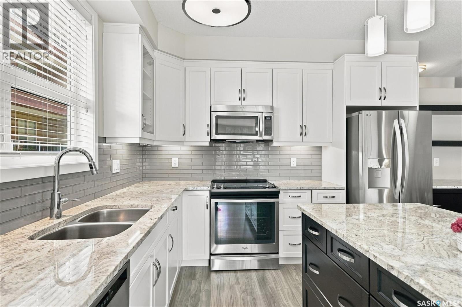 116 1025 Moss Avenue, Saskatoon, SK - Indoor Photo Showing Kitchen With Stainless Steel Kitchen With Double Sink With Upgraded Kitchen