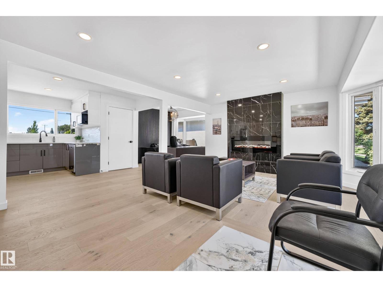 6011 93A Av Nw, Edmonton, AB - Indoor Photo Showing Living Room With Fireplace