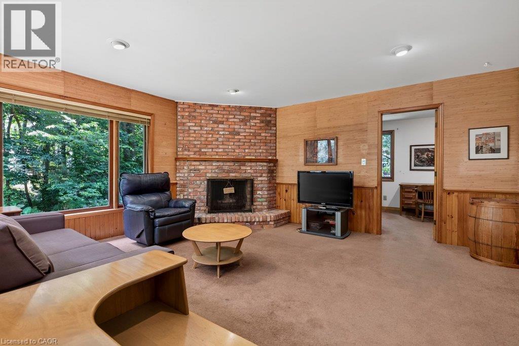family room with lots of space to relax - 44 Colquhoun Crescent, Hamilton, ON - Indoor Photo Showing Living Room With Fireplace