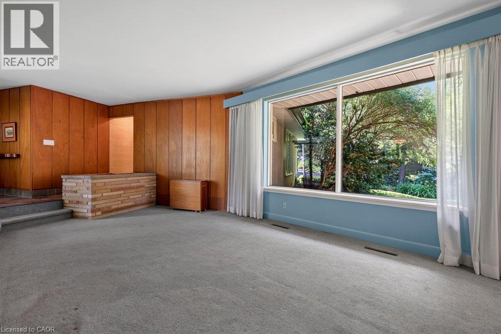 large picture window to enjoy the view of nature in the backyard - 44 Colquhoun Crescent, Hamilton, ON - Indoor Photo Showing Other Room