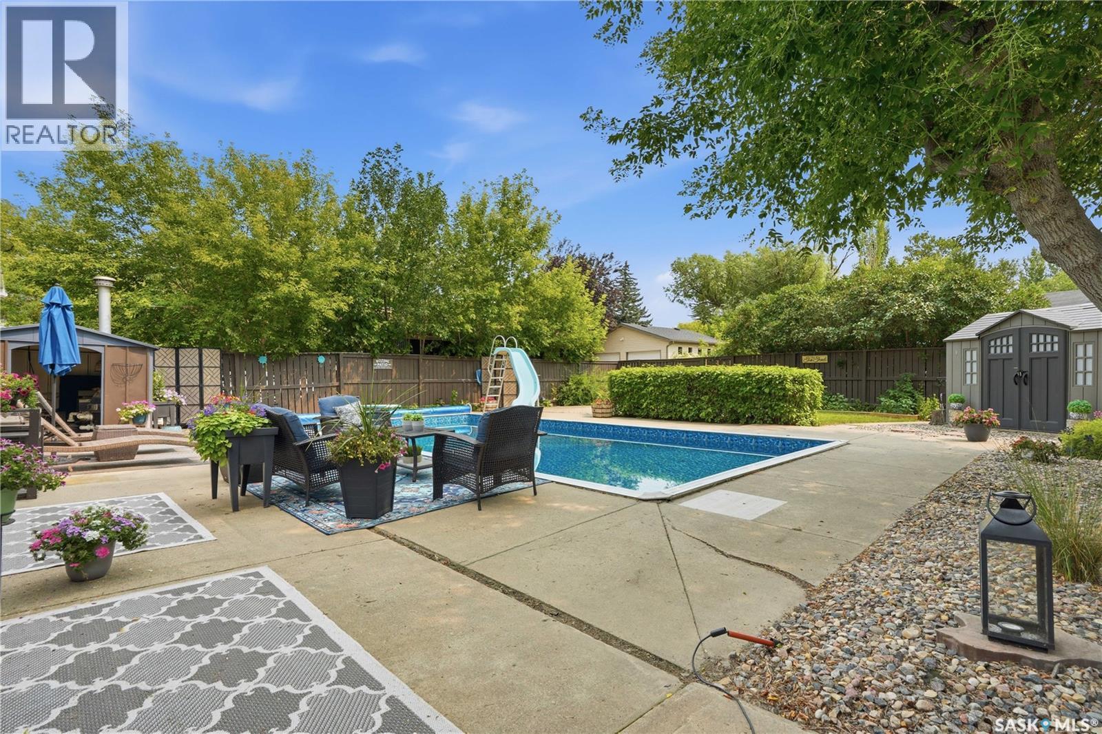 116 Mcmaster Crescent, Saskatoon, SK - Outdoor With In Ground Pool With Backyard