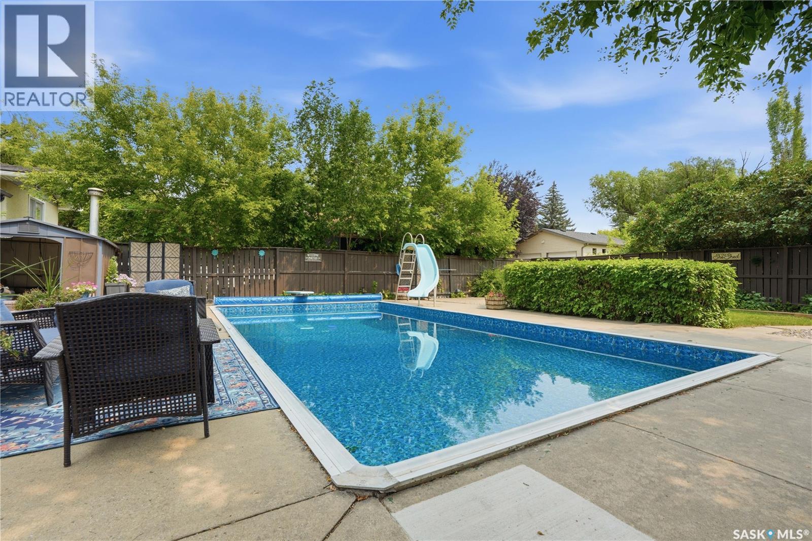 116 Mcmaster Crescent, Saskatoon, SK - Outdoor With In Ground Pool With Backyard