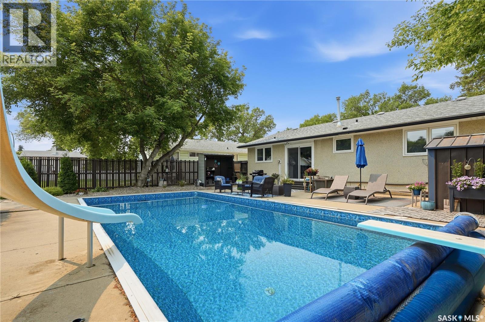 116 Mcmaster Crescent, Saskatoon, SK - Outdoor With In Ground Pool With Backyard