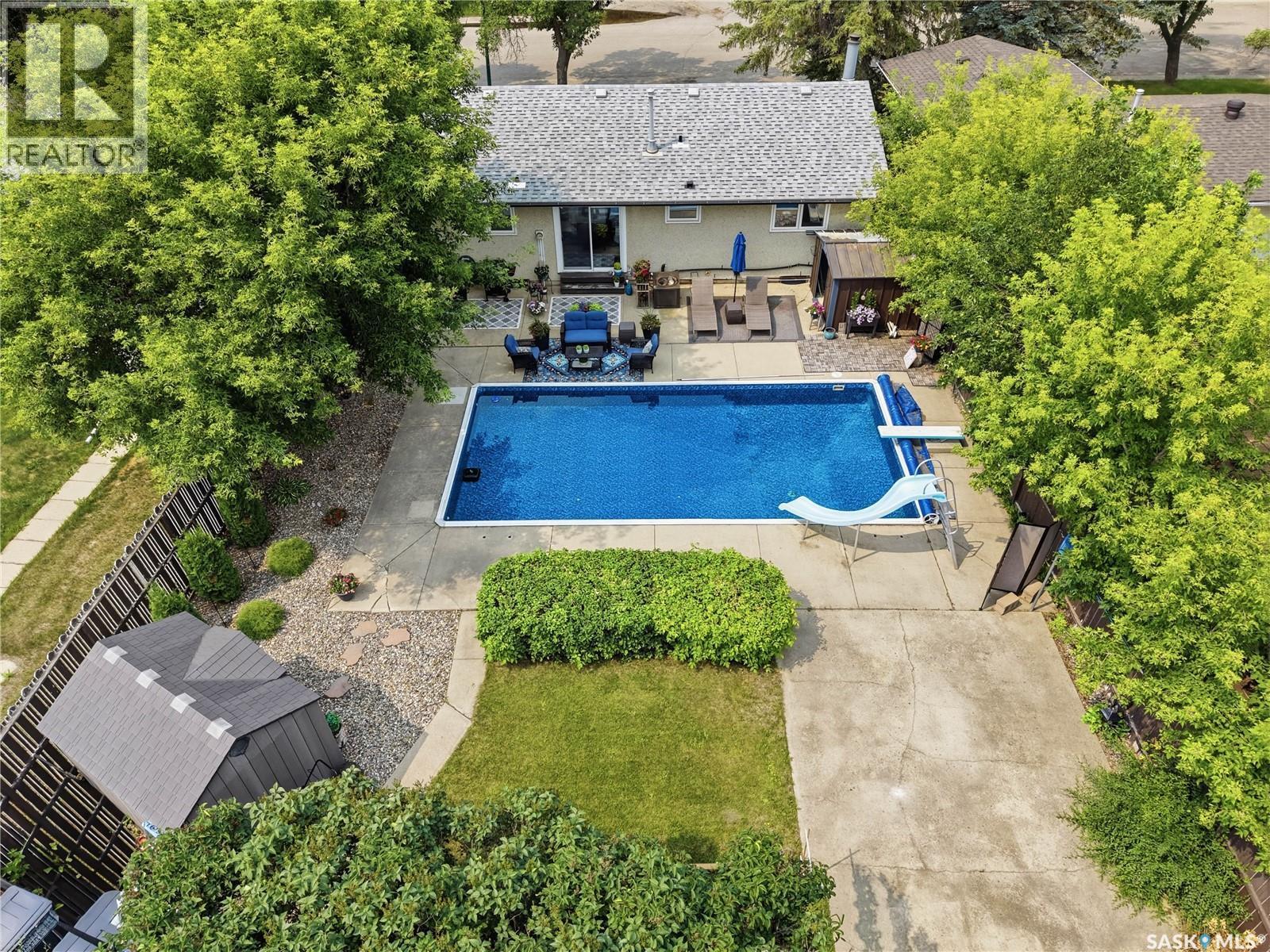 116 Mcmaster Crescent, Saskatoon, SK - Outdoor With In Ground Pool With Deck Patio Veranda