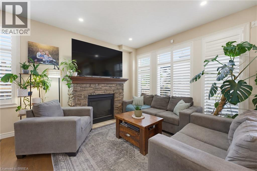 63A Clench Avenue, Brantford, ON - Indoor Photo Showing Living Room With Fireplace