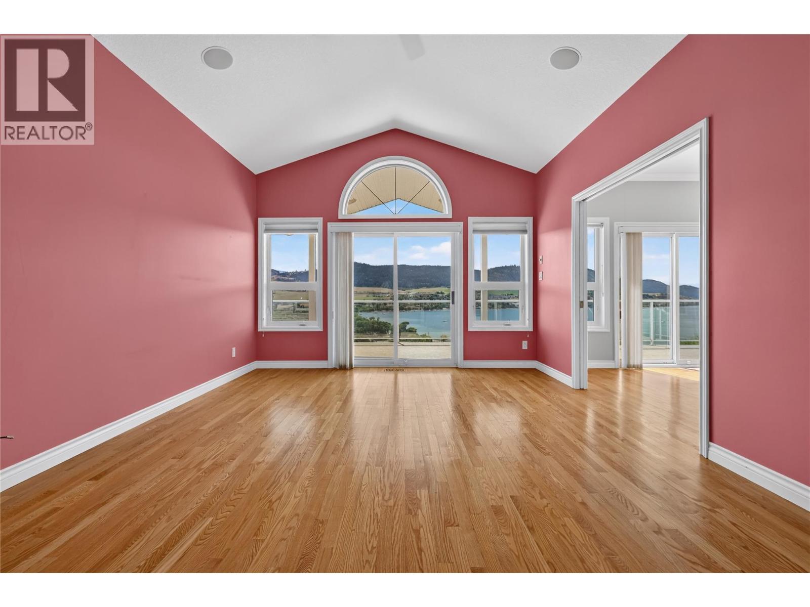 Large living room with Okanagan Lake and valley views. - 7083 Jasper Drive, Vernon, BC - Indoor Photo Showing Other Room
