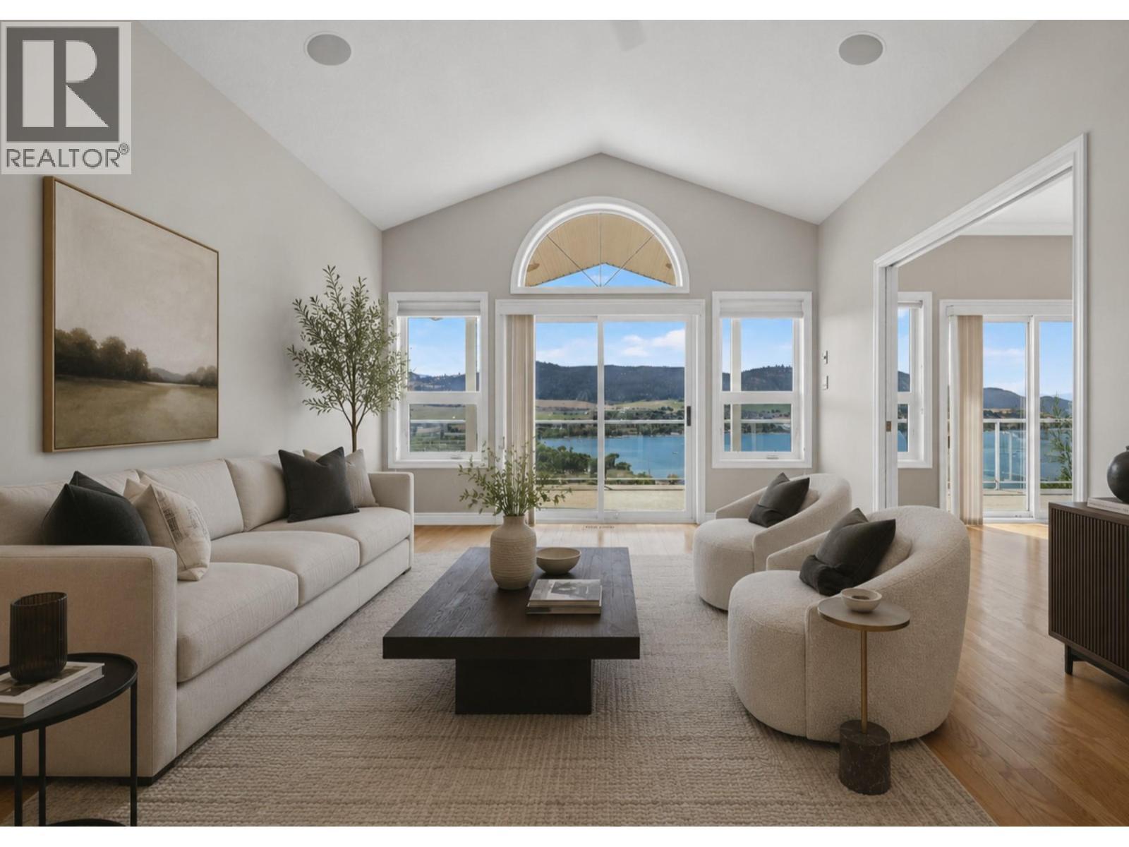 Living room virtually reimagined with paint and decor. - 7083 Jasper Drive, Vernon, BC - Indoor Photo Showing Living Room