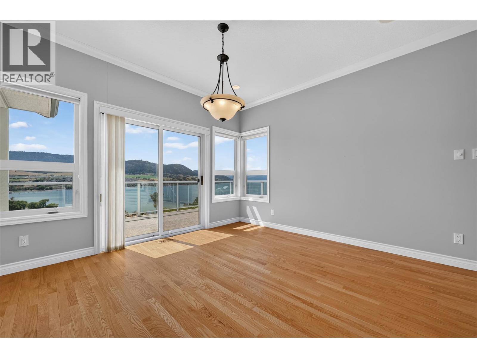 Dining room with lake views. - 7083 Jasper Drive, Vernon, BC - Indoor Photo Showing Other Room