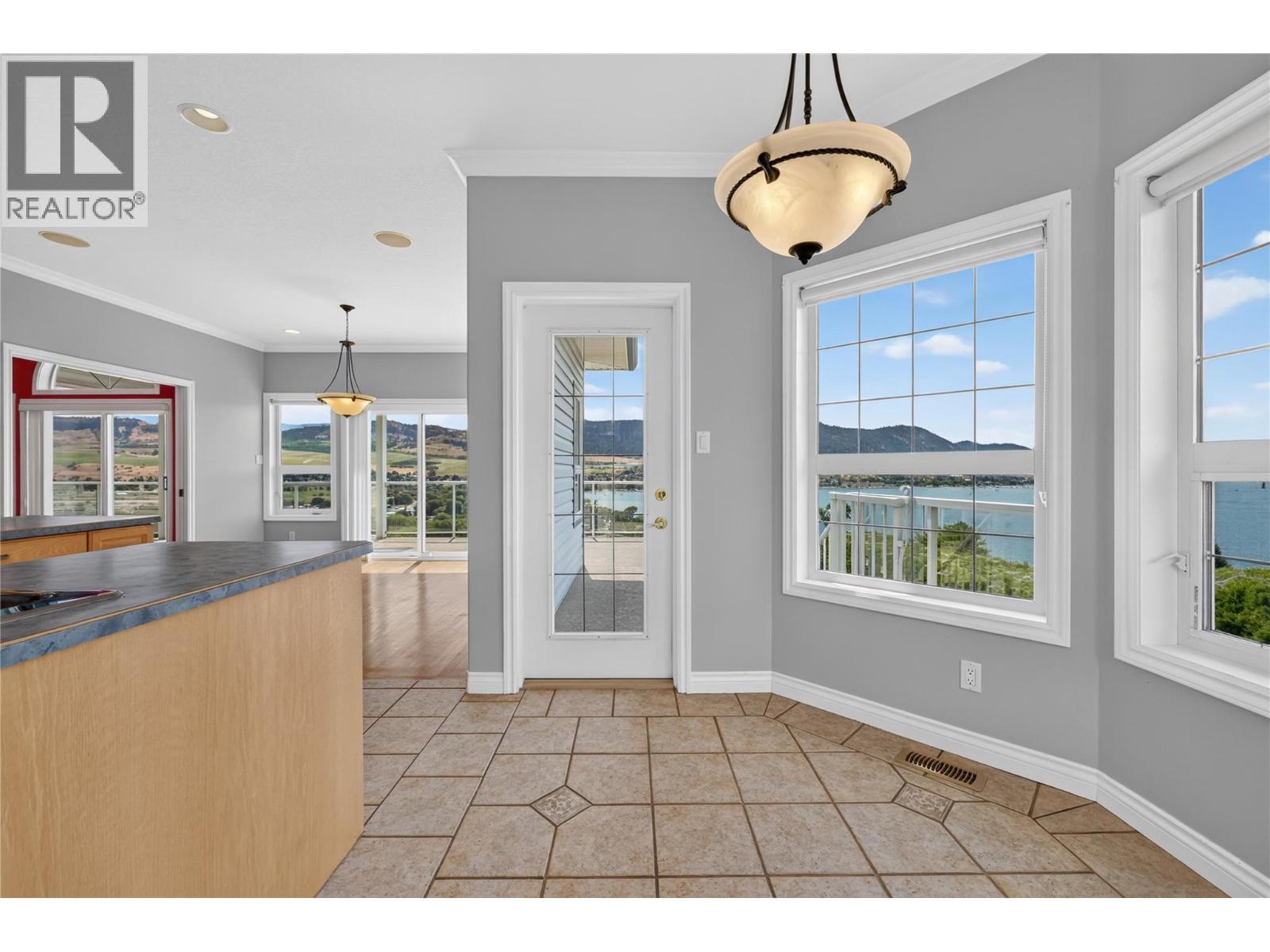 Kitchen nook with lake views. - 7083 Jasper Drive, Vernon, BC - Indoor