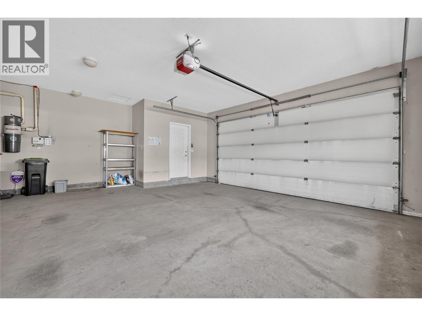 Large garage. - 7083 Jasper Drive, Vernon, BC - Indoor Photo Showing Garage